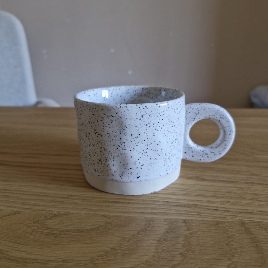Raw phone photo of the same mug
